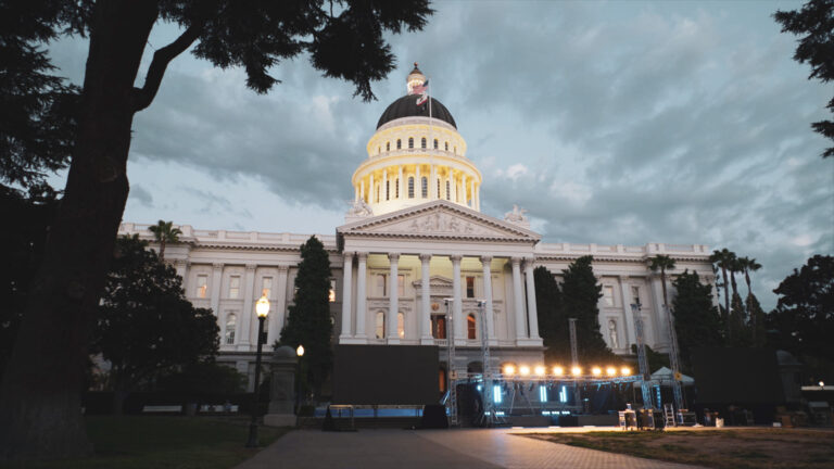 Outdoor stage in front of the California State Capitol by day